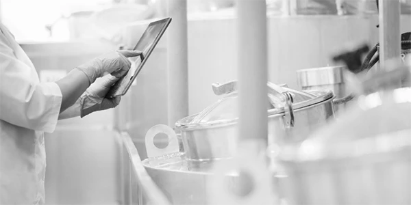 Employees using computer tablets to operate devices