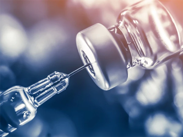 Injection needle extracting biologics from ampoule