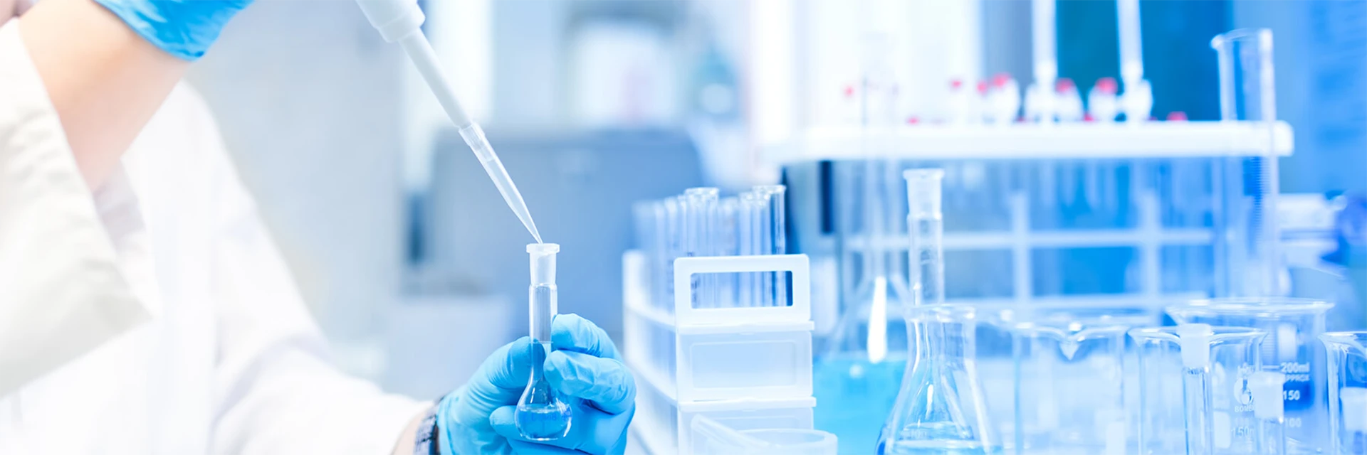 Researcher conducting experiments with laboratory equipment