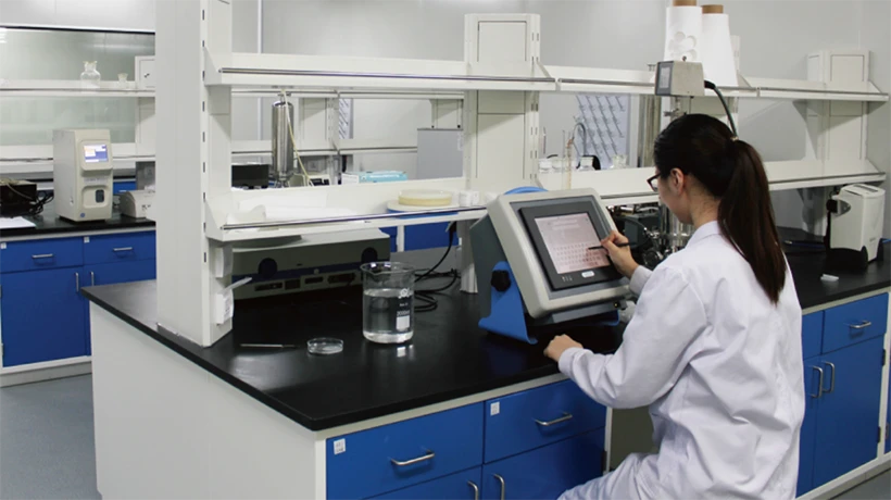 Researchers are checking the product compatibility data displayed on the computer in the laboratory
