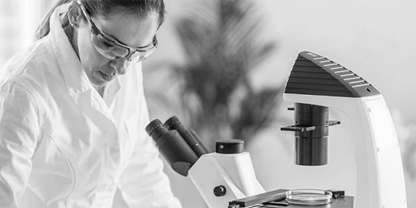 A filter material researcher taking notes