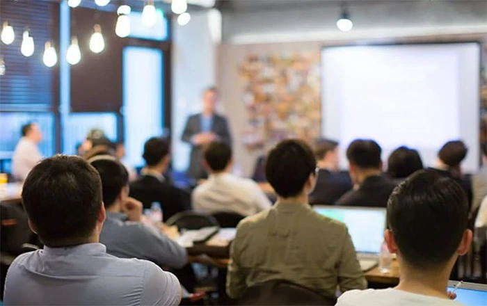 Employees receiving training in the meeting room