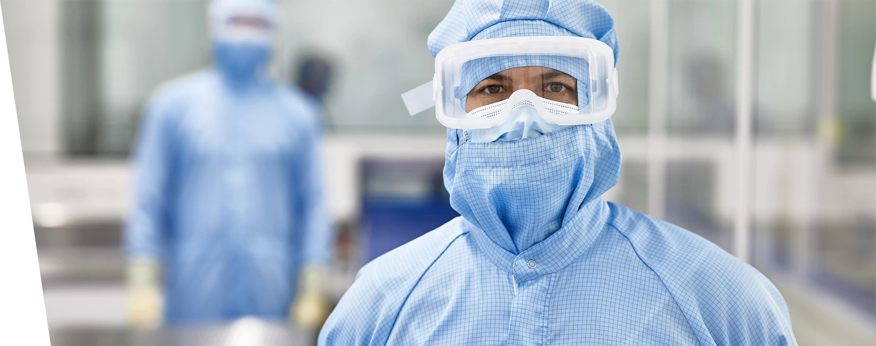 A researcher wearing a complete protective suit